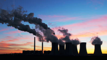coal plant smoke on sunset